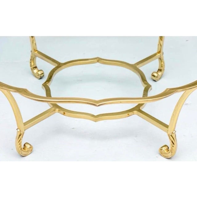 La Barge Hollywood Regency style round brass and glass cocktail table made in Italy. The brass has a wonderful warm and...