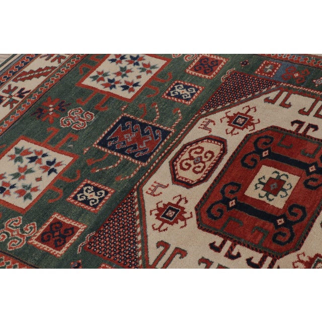Late 20th Century Rug & Kilim’s Kazak-Inspired Rug, Tribal Geometric Patterns in Green & Red For Sale - Image 5 of 10