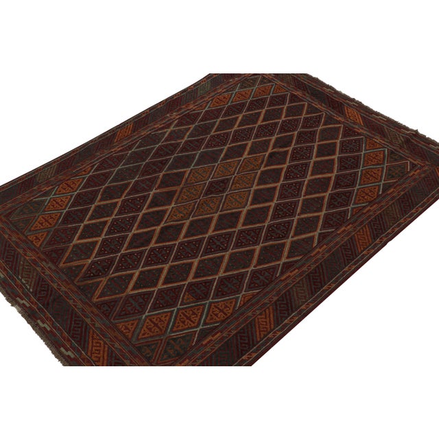 Hand knotted in wool, this 7x9 Baluch rug represents a new line of tribal carpets in the Modern Classics Collection by Rug...