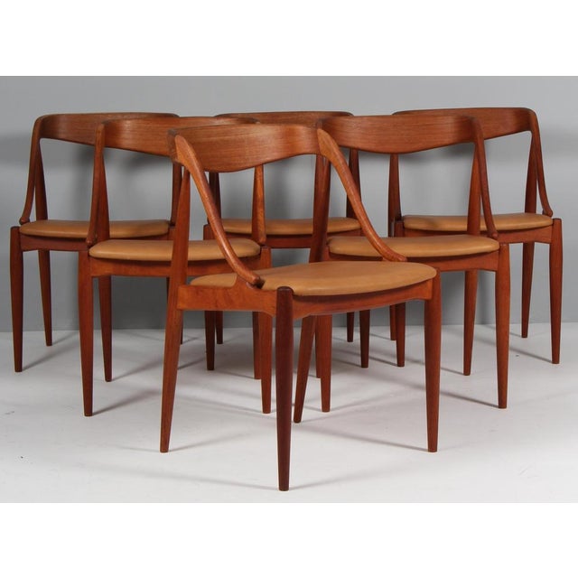 Johannes Andersen six dining chairs in solid oiled teak. New upholstered with vintage tan aniline leather. Model 16, made...