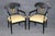 An elegant and highly decorative set of four Neoclassical Empire-style armchairs, distinguished by their sophisticated...