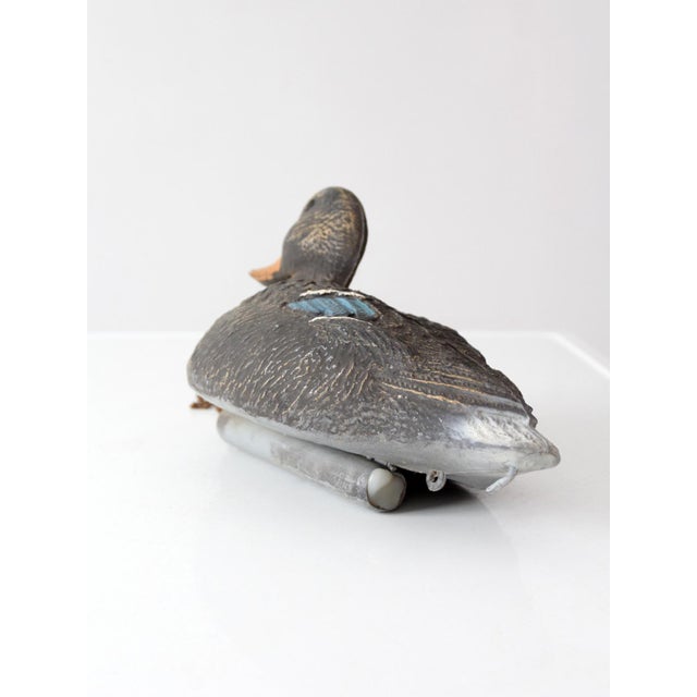 A vintage 1970s Victor mallard hen duck decoy featuring a molded feathered body, glass eyes, and original chain with round...