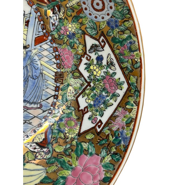This exquisite porcelain bowl is a stunning example of traditional craftsmanship, adorned with a vibrant and intricate...
