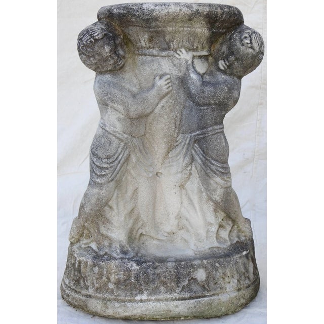 Two cherubs on each pedestal appear to be holding the pedestal up to display your treasures. They are clothed in drapes...