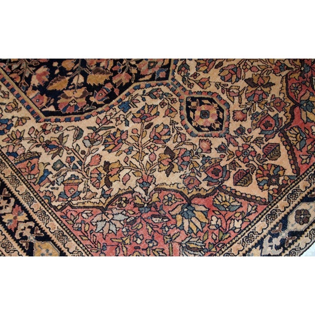 Handmade antique Sarouk Farahan rug in original good condition, has some low pile. The rug has been made in the beginning...