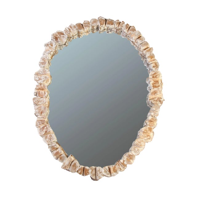 A modern wall mirror with a organic teak block frame. The handmade organic teak blocks frame brings out beauty of natural...