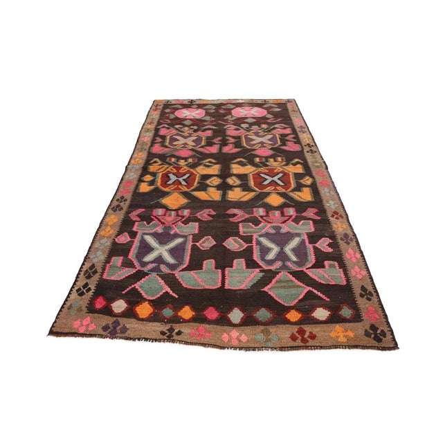 Vintage handwoven decorative kilim rug from Kars region of Turkey. Approximately 50-60 years old. In very good condition.