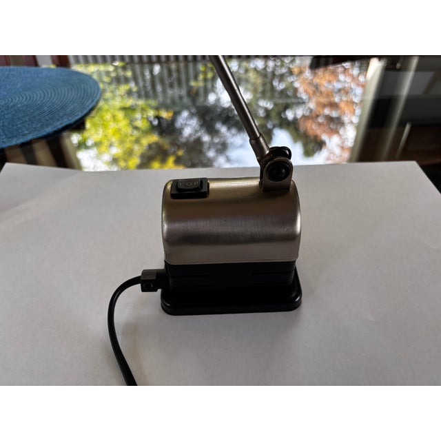 Lumina Daphinette desk lamp with a clean design, articulated arm and tilting head, two power settings, discreet elegance,...