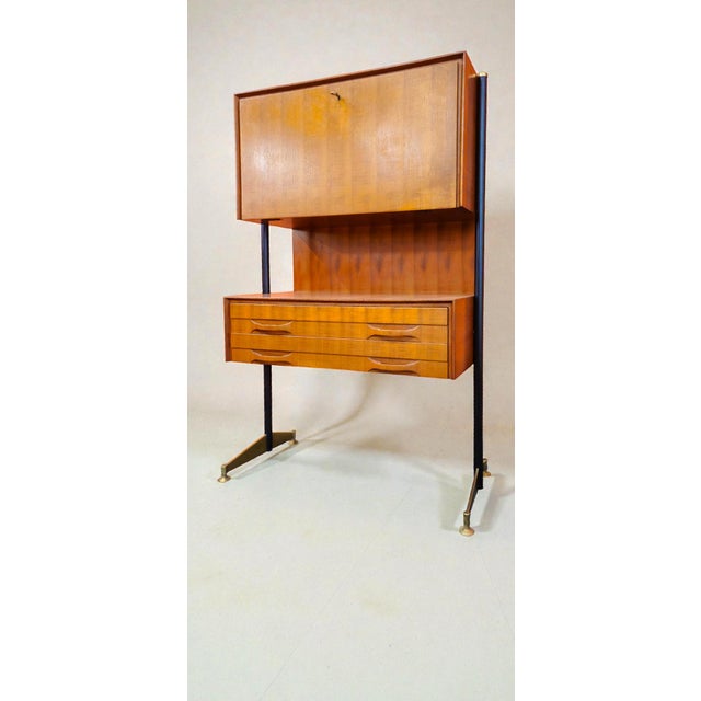 This stylish piece is an Italian bar cabinet or desk in Mid-Century Modern style (often referred to as a bar cabinet or...