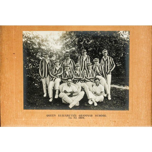 A charming and evocative glimpse into early 20th-century English sporting life, this antique framed photograph captures a...