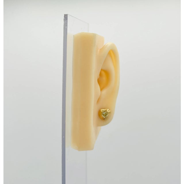 Beautiful 1.00 ct. yellow diamond heart shapes. Handmade in 18k yellow gold. Push back setting.