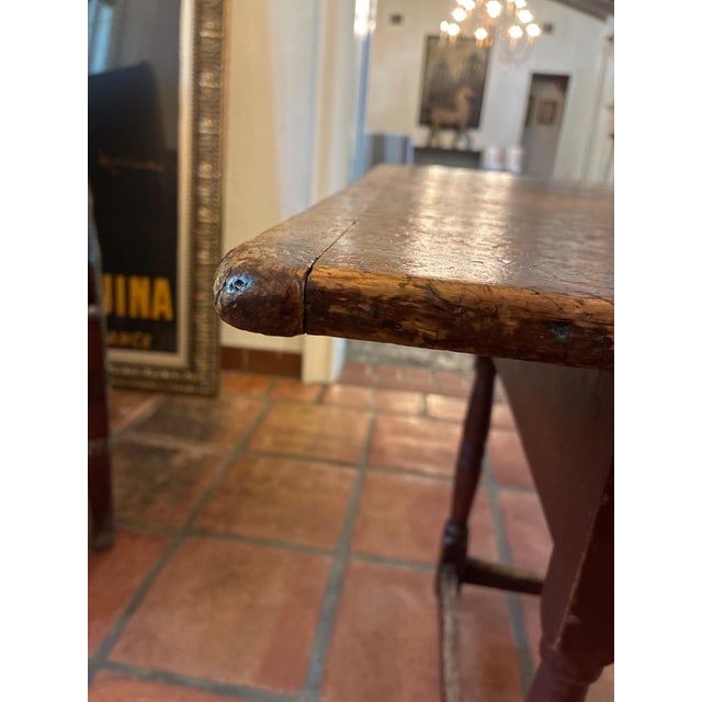 Authentic 18th century Colonial-era wooden table, crafted in solid wood with traditional breadboard end construction and...