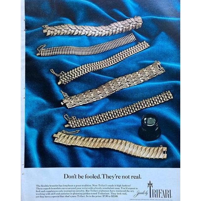 1966 goldtone cluster of leaves clip earrings. Marked crown "TRIFARI©" on the clips. Measure:1 3/16 inches long by 7/8...