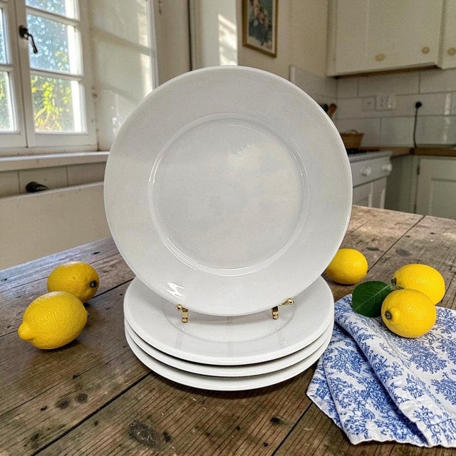A substantial set of four Apilco France Classic Whiteware rimmed luncheon plates, produced in France during the late...