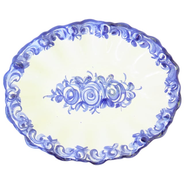 Charming vintage Portuguese faience bowl in blue & white. Lovely undulating scalloped edge with a center medallion of...