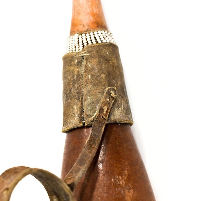 The Maasai milk gourd, a significant symbol in Maasai culture, epitomizes sustenance, community, and heritage within this...