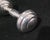About the Piece: Elevate a silver collection or nursery display with this iconic sterling silver dumbbell baby rattle by...