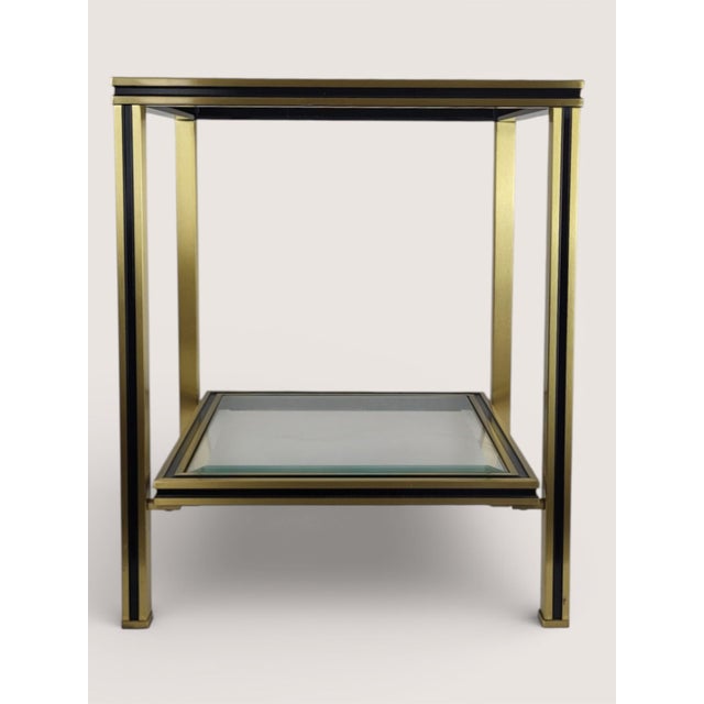 Side table in the style of Pierre Vandel's Parisian designs from the 1970s. Beveled white glass top. Black and gold...