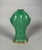Kangxi period porcelain vase (1662-1722) . Monochrome green glaze. The design features "carps joined together." The gilt...