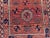 1900 - 1909 Antique Afghan Baluchi Rug With Geometric Tribal Medallion Design in Terracotta and Navy Rug For Sale - Image 5 of 11