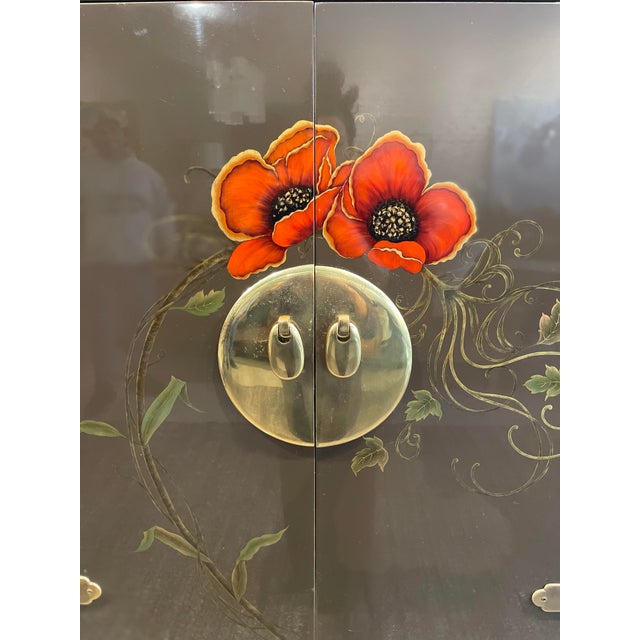 Elevate your entertaining space with this striking vintage Mastercraft bar cabinet, a true statement piece that blends...