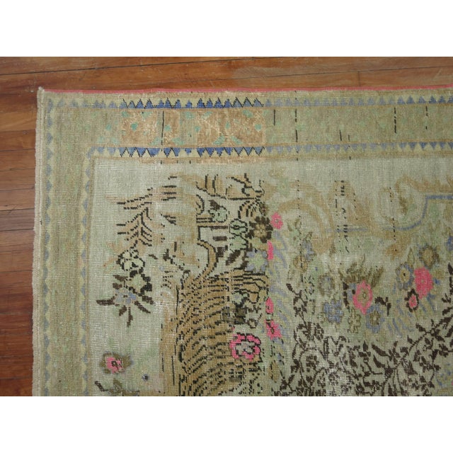 Eclectic style vintage Turkish Anatolian rug featuring bright pink accents sparkling throughout.
