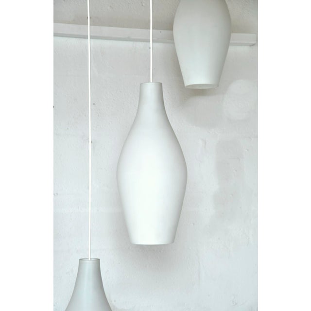 Mid-Century Scandinavian Three-Drop Cascade Opaline Cased Glass Bowling Pin Lights in Teak, 1960s For Sale - Image 9 of 15