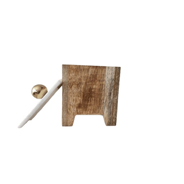 This is a small, rectangular wooden box with a natural light wood finish. It is topped with a smooth, white marble lid and...