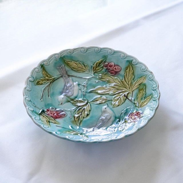 A wonderful trio of antique 19th-century barbotine bird plates. lovely turquoise color, a pair of birds perched on...