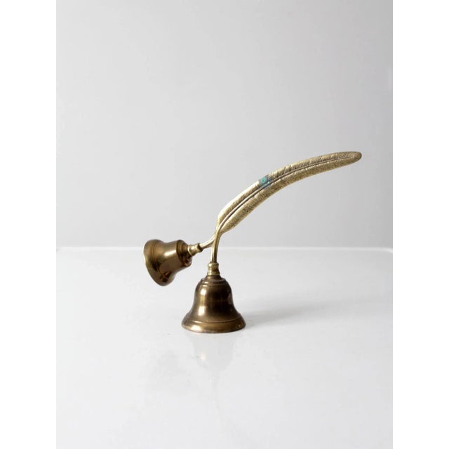 This is a vintage English double brass bell. Shaped to look like q quill in an ink pot, it is useful as a desk or hotel...