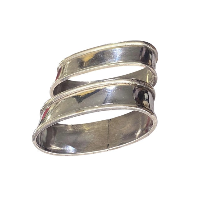 Elegant Set of two antique European solid silver napkins rings holders in an oval design. Each is marked 0900 and together...