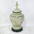 This striking pair of ceramic table lamps features hand-painted Greco-Roman scenes, evoking the classical elegance of...