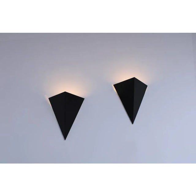 Striking set of two postmodern wall sconces model 'Kite', produced during the 1980ies. Simple and clever designed...