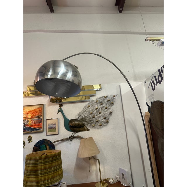 Original Carrera marble base with a sleek steel arc telescoping arm that slides to extend reach. An aluminum dome shade...