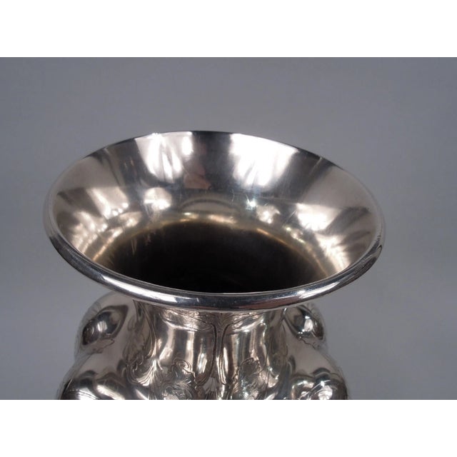 Tall Victorian Classical sterling silver vase. Made by Tiffany & Co. in New York. Lobed baluster with inset neck and...