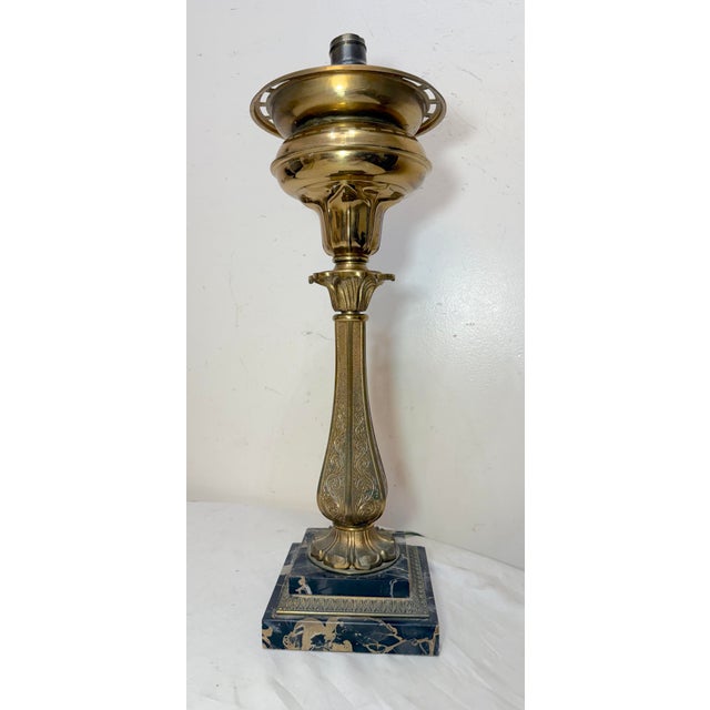 This Antique ornate Henry Hooper & Co. electrified brass and marble astral table lamp is a stunning piece from the 19th...
