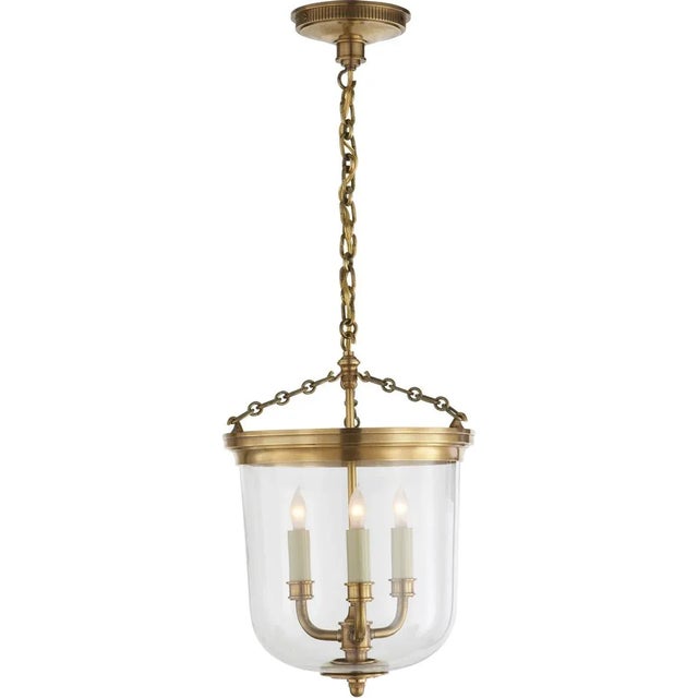 Merchant Lantern in Hand-Rubbed Antique Brass with Clear Glass Designer: Thomas O'Brien Canopy: 5.25" Round Mounting:...