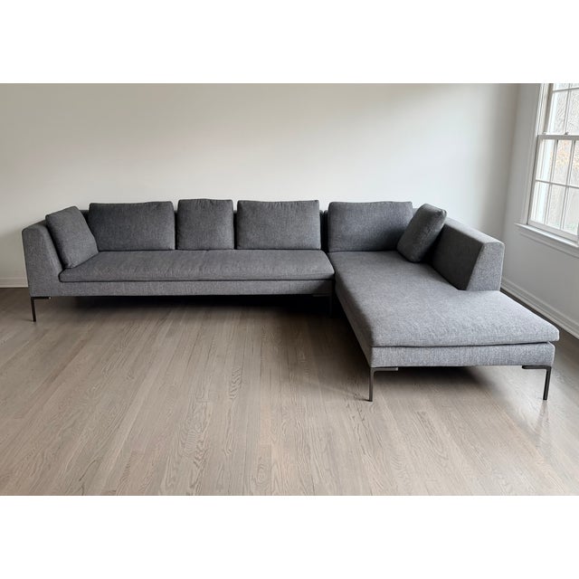 A two-piece B&B Italia Charles sectional sofa, designed by Antonio Citterio, upholstered in a sophisticated heathered dark...