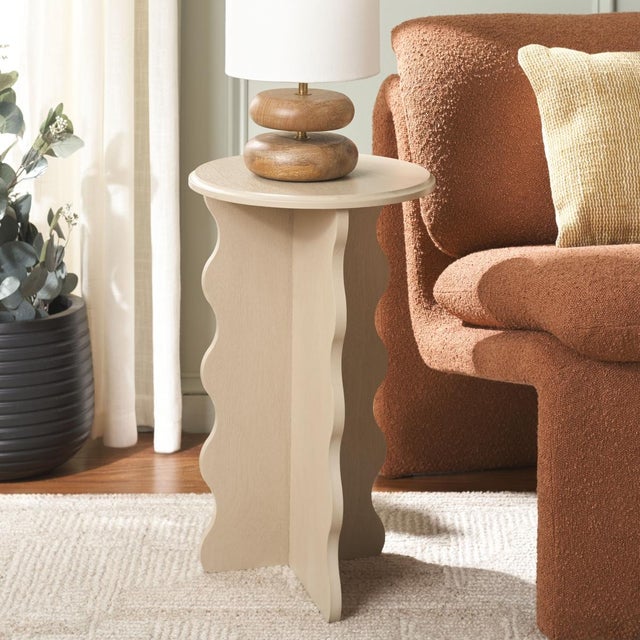 Add a touch of artistry and elegance to your home with the Lilith Wavy Accent Table in a stunning natural finish....