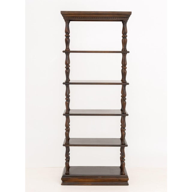 Baroque Style Five-Tier Walnut Etagere, with turned wood supports on carved rectangular base. 71.25" H x 28" W x 13.75" D....