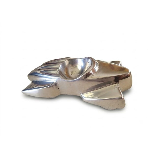 This striking 1930s Art Deco Streamline Moderne cast aluminum roadster ashtray captures the sleek, aerodynamic styling...