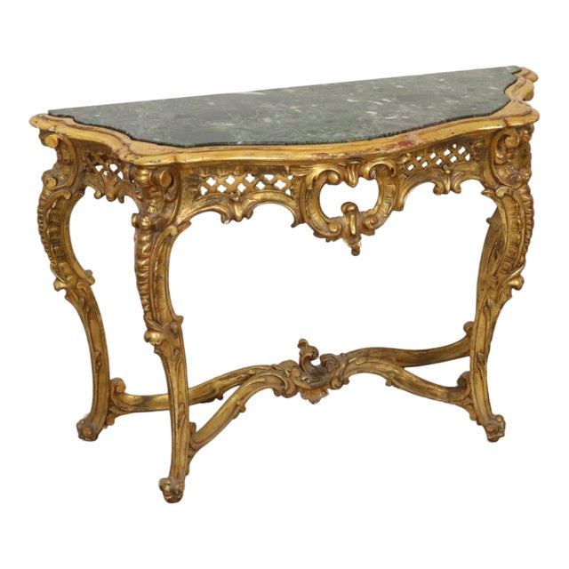 Imposing and impressive classical console in Louis XV style, with gold-leaf gilded wood and gesso, with a green veined...
