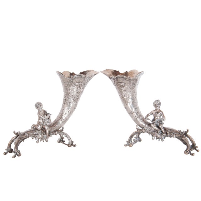 A fine pair of antique German silver cornucopia vases with cherubs, Hanau, circa 1890. The vases most likely by Friedrich...