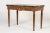An Early 19th Century Italian Walnut Console Table with Marble Top. This fine Italian console or side table stands on four...