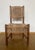 Beautiful woven vintage chair, with robust wooden base and woven back and seating. Most likely the chair was manufactured...
