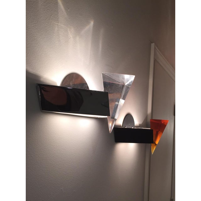 A fan-shaped wall sconce from Oggetti's Prisma collection, designed by Muranese lighting master Carlo Nason. A faceted...