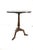This is a Theodore Alexander pedestal side table featuring a dark top with engraved brass studs with butterflies engraving...