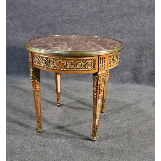 French Empire Marble Top Ormolu Center Table or accent table. Marble top with Brass accent and hardware. Single pull-out...