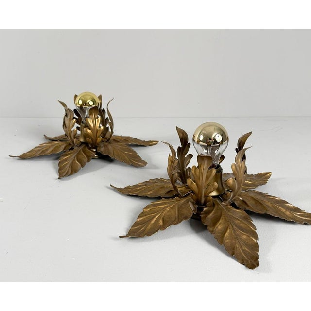 Wall lamps/wall sconces, Hollywood Regency style, 1970s, Italy, metal construction, decorated with gold leaf, Dimensions...