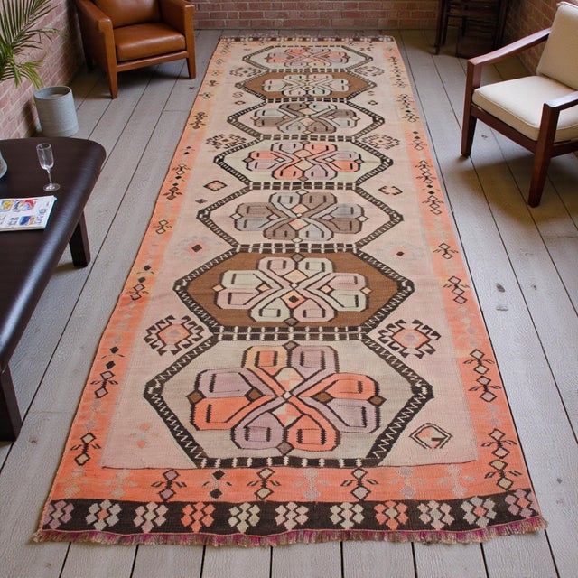 This exceptional mid-century Anatolian kilim runner, hailing from the Kars region of Eastern Anatolia, exemplifies the...